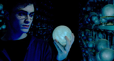 Harry Potter holds the orb that held the prophecy about "the one with the power to vanquish the Dark Lord."