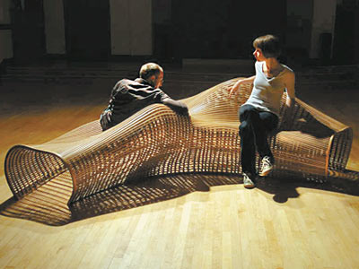 Furniture artist Matthias Pliessnig shapes furniture according to the moisture of the wood inside, allowing the structure to move and breathe over the course of its life. (Sarah Glover / Staff Photographer)
