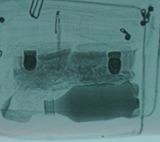 Courthouse X-ray shows hoagie, soda.