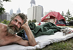 Dennis Myers at "home" on 15th Street near a Vine Street Expressway off-ramp. The city has told him to move for an area cleanup.