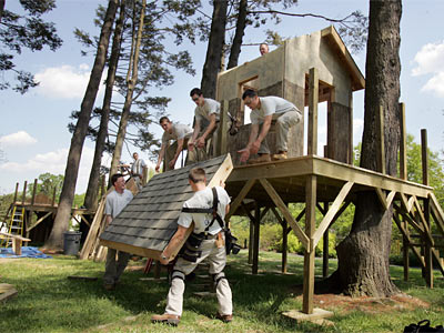 Students from the Williamson Free School of Mechanical Trades hoist a roof onto their tree house at Tyler Arboretum in Media. A Tyler jury selected 16 designs from more than 30 submitted.