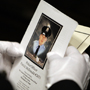 A member of Philadelphia&acute;s Highway Patrol Unit holds a program while waiting for the Funeral Mass for Officer Patrick McDonald to start inside the Cathedral Basilica Saints Peter and Paul in Philadelphia, Pa. on September 30, 2008. Officer McDonald was gunned down by Daniel Giddings on September 23rd in North Philadelphia.<br />David Maialetti /  Philadelphia Daily News<br />