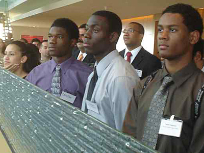 Participants in the mentoring program&acute;s anniversary celebration in the Comcast Center included (from left) Clarissa Velazquez, Craig Gay, Bryant Keal, and Steven Ferguson. The program is sponsored by  the Greater Philadelphia Hispanic Chamber of Commerce. (Rodrigo Muzell / Staff Photographer)