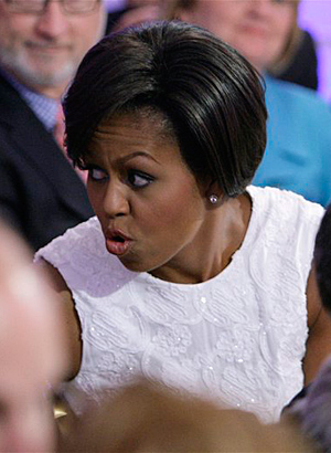 Michelle Obama, wife of President Barack Obama, wait for the start of the White House music series celebrating country music in the East Room at the White House in Washington, Tuesday, July 21, 2009.(AP Photo/Alex Brandon)