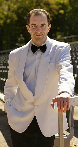 Rossen Milanov led the Philadelphia Orchestra in a summer concert at Longwood Gardens on Saturday.
