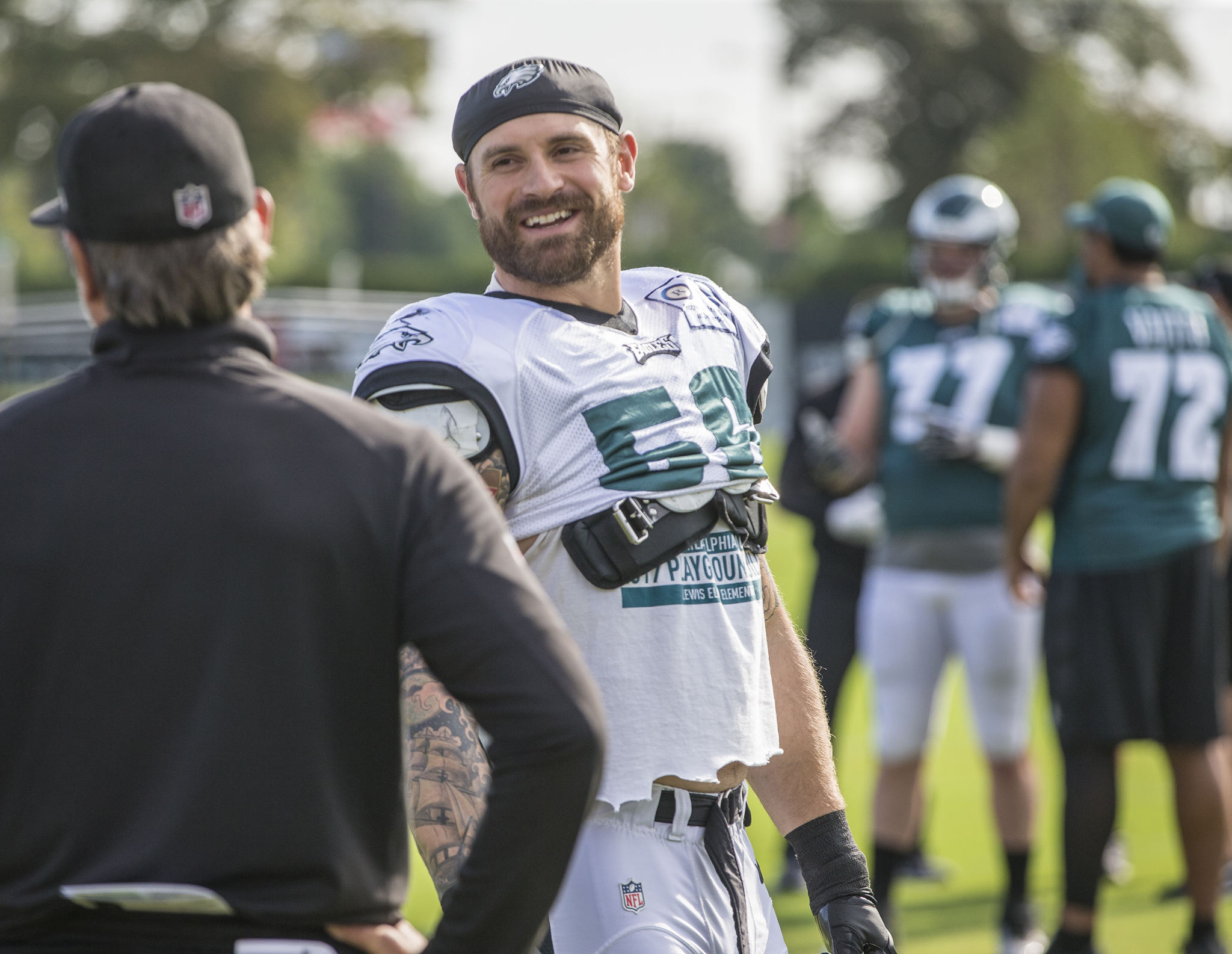 Philadelphia Eagles defensive end Chris Long (56) celebrates as he wears a  dog mask after the