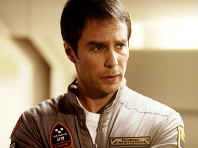 Sam Rockwell plays the sole crew member on a lunar base in “Moon”; with him is Gerty 3000 the robot, voiced by Kevin Spacey. The movie is a deceptively simple study of alienation, paranoia, and loneliness.