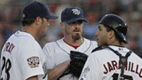 Brett Myers confers with IronPigs first baseman Andy Tracy and catcher Jason Jaramillo. (Elizabeth Robertson / Inquirer)