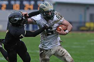 <b>Skip Harris</b> of Tabernacle is the winner of this week’s Rally Photo of the Week contest for this image of Seneca’s Steve Greco fending off Burlington Township’s Josh Sanders for extra yardage in Seneca&acute;s playoff win.<br />