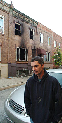Jim Hart outside the burned-out row house at 2417 S. Warnock St. where his mother, Madeline, 68, and uncle Robert Ermilo, 73, died in an overnight fire.  Fire officials said there were no smoke detectors in the dwelling.