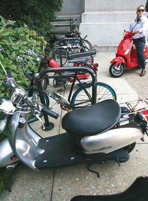 While scooters offer great gas mileage, finding places to park them can be a headache.