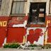 An unidentified man pulls a shopping cart with bikes in it past an abandon building at Ruth and Somerset Streets in Philadelphia, Pa. on April 30, 2012.  The building is the former Orinoka Mills carpet factory in Kensington. ( David Maialetti  / Staff Photographer ) SE1ABANDON02