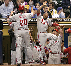 The Phillies’ Jayson Werth is greeted with enthusiasm by Jimmy Rollins (right) after following Pat Burrell’s three-run homer with a solo shot of his own in the third inning. Rollins had homered in the first inning. (Ron Cortes / Staff Photographer)