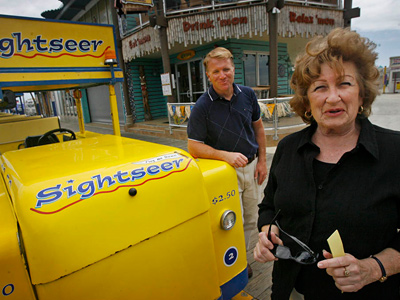 Pat Rosenello, owner of Boardwalk Sightseer, along the Boardwalk in Wildwood, with Floss Stingel, the "Voice of the Tram Car." (Alejandro A. Alvarez / Staff Photographer)
