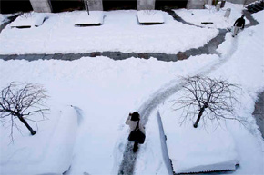 The chilling news is it&acute;s not over. Another snow belt is on the way, even as the city still struggles to dig out. Officials say if more white stuff falls, they&acute;ll rise to the task. Above, slipping to work near City Hall. (David Maialetti / Staff Photographer)