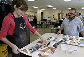 Tyler School of Art students Ashley Limes and Ian Williams review their work in the printmaking workshop on the school's Elkins Park campus. In January, Tyler classes will move to Temple's main campus. (Akira Suwa / Inquirer)