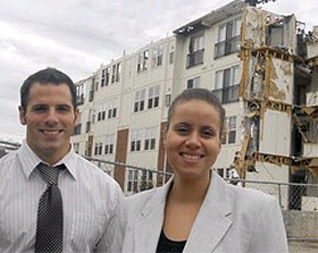 Karisa Nelson and Dan Kelly, agents for Riverwalk at Millennium, in front of the building that was her home. (Ron Tarver / Inquirer)