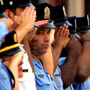 Philadelphia police officers stand at attention as family, friends and colleagues of slain Philadelphia Police Officer Patrick McDonald leave the scene of the shooting on the 2200 block of Colorado Street in North Philadelphia on September 24, 2008. Officer McDonald was repeatedly shot by Daniel Giddings after a car stop on Tuesday September 23. <br />David Maialetti /  Philadelphia Daily News<br />