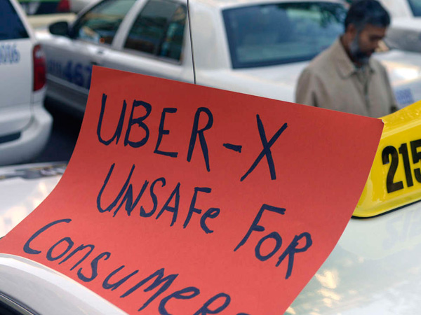 File photo: Drivers with the Taxi Workers Alliance of Pennsylvania protested Uber. TOM GRALISH / Staff Photographer