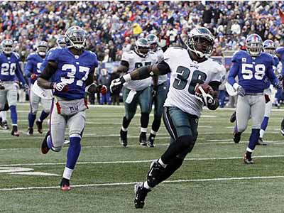 Philadelphia Eagles Brian Westbrook jumps over the pile and into the  endzone for a 1 yard touchdown late in the 2nd quarter at Giants Stadium in  East Rutherford, New Jersey on December