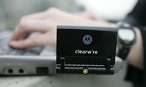 A Clearwire wireless card is shown in use at a park near the Space Needle in Seattle. Comcast Corp., Time Warner Cable Inc. and others joined with Sprint Nextel Corp. and Clearwire Corp. today to form a joint venture to market high-speed Internet or video on mobile devices.<br /><br />