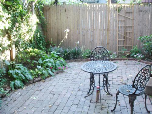 This is the same yard a little over a year later  (September 2006.)  Plantings were still mostly hosta and perennials.